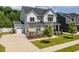 Beautifully designed home with a two-car garage and meticulously maintained landscaping at 74 Permit Ct, Chapel Hill, NC 27517