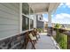 Cozy front porch sitting area, great for enjoying the neighborhood views and fresh air at 74 Permit Ct, Chapel Hill, NC 27517