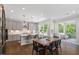 Open-concept kitchen with modern gray cabinetry, quartz countertops, and stainless steel appliances at 74 Permit Ct, Chapel Hill, NC 27517
