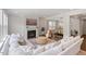 Bright living room with a fireplace, large sofa, and an open layout, perfect for relaxing at 74 Permit Ct, Chapel Hill, NC 27517