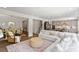 Open concept home featuring a living room, dining area, and kitchen with neutral colors and hardwood floors at 74 Permit Ct, Chapel Hill, NC 27517