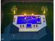 Aerial view of the backyard pool with fire bowls and lounge chairs at 7545 Hasentree Club Dr, Wake Forest, NC 27587