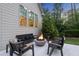 Backyard patio with a modern fire pit and comfortable seating, ideal for outdoor gatherings at 7545 Hasentree Club Dr, Wake Forest, NC 27587