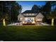 Spacious backyard featuring a pool, lounge chairs, fire feature, and a well-manicured lawn at 7545 Hasentree Club Dr, Wake Forest, NC 27587