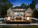 Beautiful backyard with an in-ground pool, lounge chairs, and fire bowls, perfect for entertaining at 7545 Hasentree Club Dr, Wake Forest, NC 27587