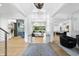 Elegant foyer with hardwood floors, high ceilings, and views into the living spaces with stylish decor at 7545 Hasentree Club Dr, Wake Forest, NC 27587