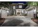 Charming multi-car garage home showcasing stone accents, double doors, and meticulous landscaping at 7545 Hasentree Club Dr, Wake Forest, NC 27587