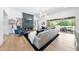 Airy living room with a modern fireplace, stylish decor, and sliding glass doors to a patio at 7545 Hasentree Club Dr, Wake Forest, NC 27587