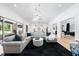 Bright living room featuring hardwood floors, modern decor, an open layout, and access to an outdoor space at 7545 Hasentree Club Dr, Wake Forest, NC 27587