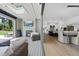 Bright living space with hardwood floors, fireplace, and large glass doors that open to an outdoor patio at 7545 Hasentree Club Dr, Wake Forest, NC 27587