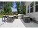 Outdoor kitchen featuring a stone surround, grill, and counter space, perfect for entertaining outdoors at 7545 Hasentree Club Dr, Wake Forest, NC 27587