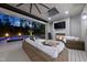 Indoor-outdoor living space featuring fireplace, TV, and views of the pool and backyard at 7545 Hasentree Club Dr, Wake Forest, NC 27587