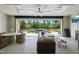 Enclosed outdoor space with a lounge area, a dining area, an outdoor kitchen, and views of the pool at 7545 Hasentree Club Dr, Wake Forest, NC 27587