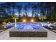 Inviting backyard pool and spa featuring fire bowls and lounge seating at 7545 Hasentree Club Dr, Wake Forest, NC 27587