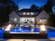 Backyard pool with a fire feature creating a relaxing and luxurious outdoor space at 7545 Hasentree Club Dr, Wake Forest, NC 27587