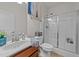 Bathroom boasts glass shower door, neutral paint, and wooden vanity at 8132 Wheeler Woods Dr, Apex, NC 27539