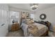 Cozy bedroom featuring a wooden bed frame, ceiling fan, and tasteful decor at 8132 Wheeler Woods Dr, Apex, NC 27539