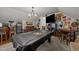 Entertaining game room featuring a pool table, large TV, and bar area at 8132 Wheeler Woods Dr, Apex, NC 27539
