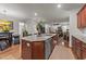 Spacious kitchen island featuring granite countertops and stainless steel appliances at 8132 Wheeler Woods Dr, Apex, NC 27539