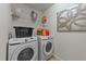 Modern laundry room includes front-load washer, dryer, and shelving for storage at 8132 Wheeler Woods Dr, Apex, NC 27539