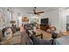 Spacious living room featuring an open floor plan, modern decor, and hardwood floors at 8132 Wheeler Woods Dr, Apex, NC 27539
