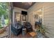 Cozy screened porch featuring outdoor seating and a view of the wooded backyard at 8132 Wheeler Woods Dr, Apex, NC 27539