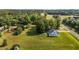 Lovely home with a large manicured front lawn and mature trees on a beautiful sunny day at 820 Water Plant Rd, Zebulon, NC 27597