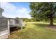 Large backyard provides a grassy lawn, mature trees and an above ground pool at 820 Water Plant Rd, Zebulon, NC 27597