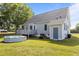 Backyard view of home with a deck, an above ground pool, and an outdoor lawnmower at 820 Water Plant Rd, Zebulon, NC 27597