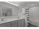 Updated bathroom with double vanity, bright lighting, and modern fixtures at 820 Water Plant Rd, Zebulon, NC 27597