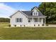 Charming single-story home featuring a welcoming front porch and well-manicured lawn at 820 Water Plant Rd, Zebulon, NC 27597
