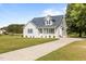 Charming two-story home with a well manicured lawn and a long drive at 820 Water Plant Rd, Zebulon, NC 27597