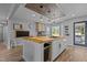 Bright kitchen features a wooden countertop island, updated appliances, and a large window at 820 Water Plant Rd, Zebulon, NC 27597