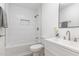 Updated bathroom featuring a shower over tub with white tiling and a modern vanity at 828 Cotton Pl, Raleigh, NC 27601