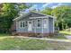 Charming home with gray siding, a brick foundation, and a small staircase at 828 Cotton Pl, Raleigh, NC 27601