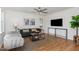 Bright living room with modern furniture, hardwood floors, and a ceiling fan at 828 Cotton Pl, Raleigh, NC 27601
