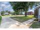 Street view of the house's corner lot and neighborhood; sidewalks with lush green grass at 828 Cotton Pl, Raleigh, NC 27601