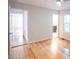 Comfortable bedroom with hardwood floors, a ceiling fan, and access to both a bathroom and hallway at 90 Oak Leaf Ln, Chapel Hill, NC 27516