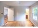 Bright bedroom features hardwood floors, fresh paint, and ensuite bathroom at 90 Oak Leaf Ln, Chapel Hill, NC 27516