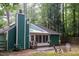 Beautiful home exterior showcasing rear facade and cozy outdoor seating area at 90 Oak Leaf Ln, Chapel Hill, NC 27516
