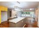 Spacious kitchen with granite island and stainless steel appliances and modern lighting at 90 Oak Leaf Ln, Chapel Hill, NC 27516