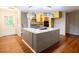Kitchen island with granite countertop, stainless steel appliances, and modern lighting at 90 Oak Leaf Ln, Chapel Hill, NC 27516