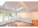 Sun-lit living room with hardwood floors and view to the porch at 90 Oak Leaf Ln, Chapel Hill, NC 27516