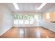 Bright sunroom with hardwood floors and views of the backyard at 90 Oak Leaf Ln, Chapel Hill, NC 27516