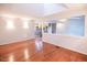 Open-concept with hardwood floors and pass-through to the kitchen at 90 Oak Leaf Ln, Chapel Hill, NC 27516