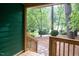 View from covered porch showcasing the natural surroundings of the property at 90 Oak Leaf Ln, Chapel Hill, NC 27516
