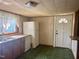 Bright kitchen featuring a double basin sink, appliances and a door, creating a functional cooking space at 912 E Pope St, Dunn, NC 28334