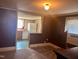 View of a living room that opens into a kitchen with ample counter space and appliances at 912 E Pope St, Dunn, NC 28334