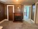 Cozy living room features hardwood-style floors, a fireplace, and neutral walls, perfect for relaxation at 912 E Pope St, Dunn, NC 28334