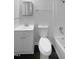 Clean bathroom featuring a classic white sink, toilet, and a shower-tub combination, providing a functional space at 916 Waring St, Durham, NC 27704